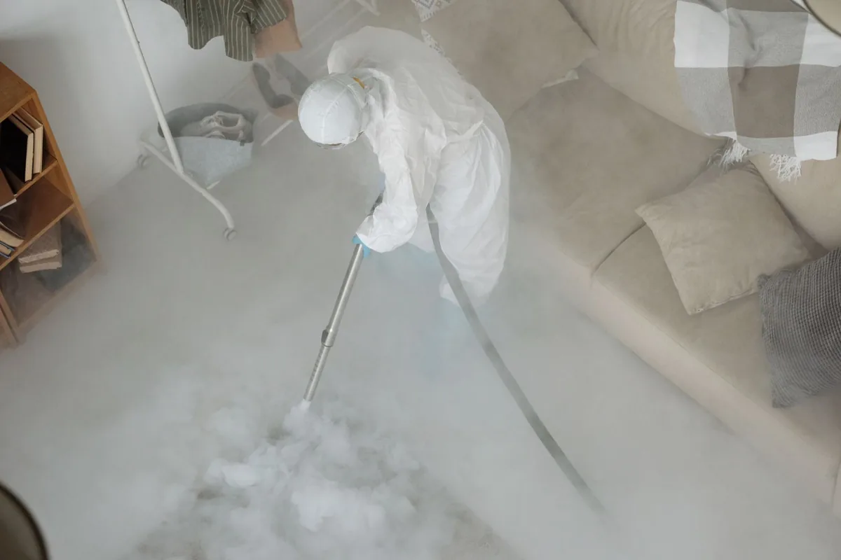 Biohazard cleanup technician in protective equipment, Dakota Ridge, CO